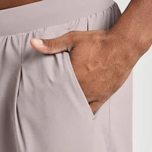 Close-up detail of men's quick-dry sports leisure pants featuring a side pocket in mauve