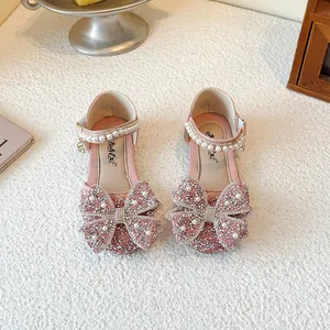 Elegant pink princess sandals for girls with rhinestone butterfly bows and pearl straps.