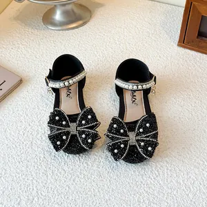 Elegant black girl's princess sandals with rhinestone bows and pearl straps for kids