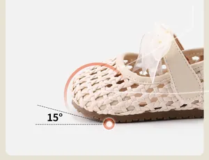 Detail of woven baby girl princess shoe featuring 15-degree toe-up design for comfort