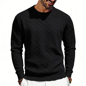 Detailed view of men's black crewneck sweatshirt with checkerboard jacquard texture