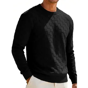 Detail showing the textured checkerboard jacquard pattern on a men's black crewneck sweatshirt