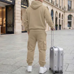 Back view of men's beige hooded tracksuit with cargo joggers in a street setting