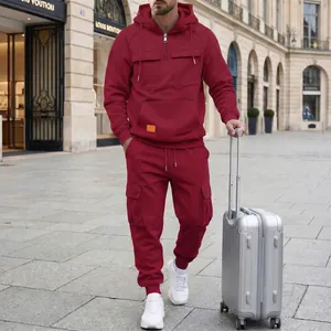 Full shot of men's burgundy hooded tracksuit featuring functional cargo pockets and zip