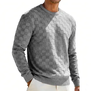 Macro view of grey men's heavy sweatshirt featuring textured jacquard checkerboard pattern