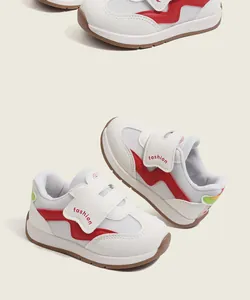 Close-up of breathable mesh baby walking shoes with red wavy patterns and Velcro straps