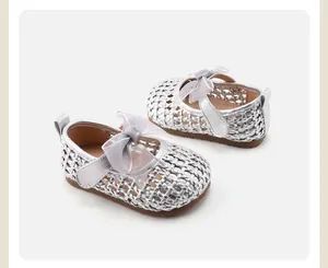Elegant silver woven baby girl princess shoes with a delicate sheer bow and soft sole