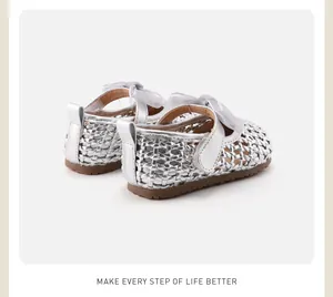 Rear view of silver woven baby girl princess shoes with delicate ribbon bow detail.