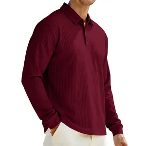 Macro detail of men's burgundy ribbed polo shirt showing textured knit fabric