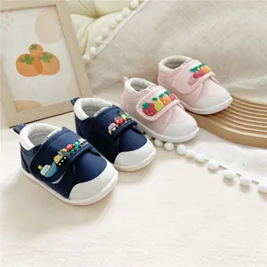 Adorable soft-sole baby walking shoes featuring colorful fruit and vehicle decorations.