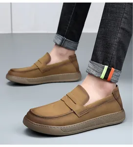 Men's brown leather loafers with thick soles and retro design detail.