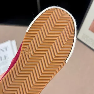 Close-up of durable brown gum rubber sole with zigzag traction for children's shoes