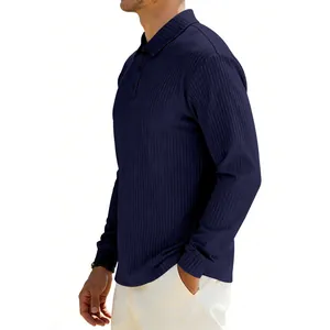Detail shot of navy blue men's ribbed polo shirt showing textured fabric and side profile.