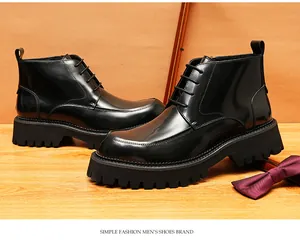 Detail of black glossy leather men's boots with thick lug soles and laces