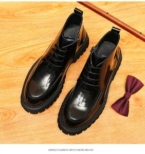 Detailed high-angle view of men's black leather boots with side zipper and thick lug sole