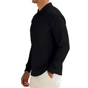 Side profile detail view of men's black long-sleeved polo shirt with ribbed texture