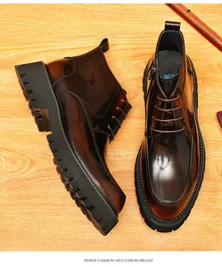 Detailed top view of brown burnished leather boots for men with thick soles and side zipper.