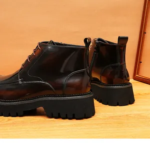 Close-up of burnished leather men's Martin boots with side zipper and platform sole.