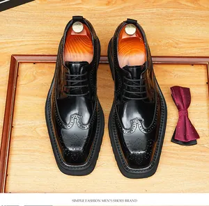 Black glossy cowhide brogue shoes for men with wingtip carving and thick sole
