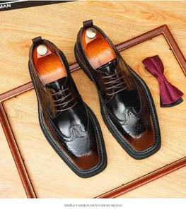 Detailed macro view of British style shiny leather Brogue shoes with wingtip carvings