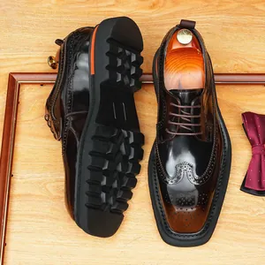 Polished leather men's British style brogue dress shoes featuring thick soles and ornate carving