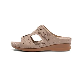 Comfortable women's wedge sandals featuring laser-cut patterns and stitching details
