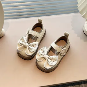 Elegant beige girls princess shoes with soft soles and large floral pattern bows