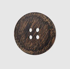 Detailed close-up showing the natural texture of a dark ebony wood 4-hole button