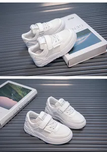 Macro view of white children's sneakers with mesh upper and velcro straps