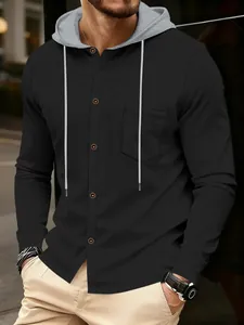 Detailed view of men's black waffle knit hoodie with button front and pocket detail.
