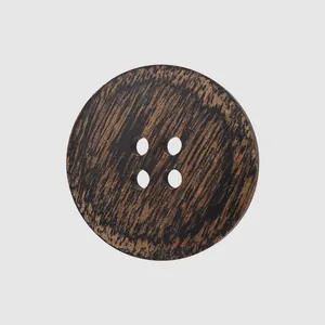 Premium round dark ebony wood button with four holes for high-end clothing and coats