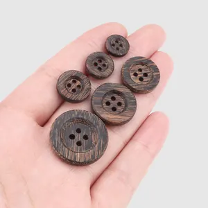 Various sizes of dark ebony wood 4-hole round buttons for clothing coats
