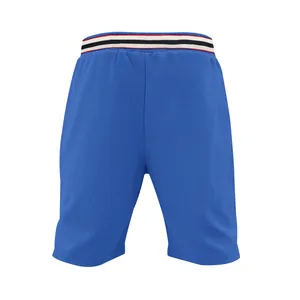 Close-up view of blue breathable mesh sports shorts featuring a striped elastic waist