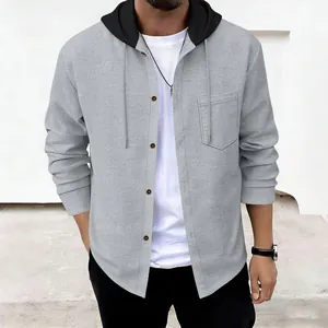Close-up detail of men's grey waffle knit buttoned hoodie with black contrast hood