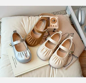 Group display of girls' Mary Jane shoes in silver, brown, and beige colors