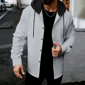 Detail shot of men's casual grey waffle knit jacket with black hooded button closure.
