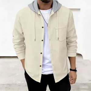 Detail of men's waffle textured hooded jacket with button pocket and grey hood