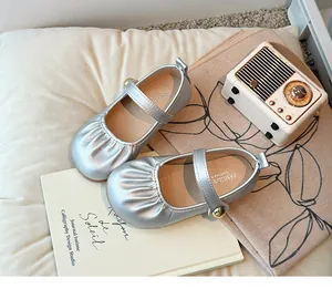 Silver Mary Jane princess shoes for girls with soft soles and decorative buckles.
