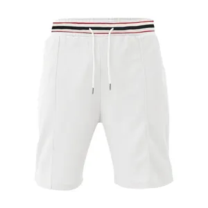 Detailed view of white men's quick-dry athletic shorts with striped waistband and waffle texture