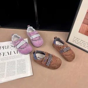 Detailed view of breathable girls' mesh sneakers with velcro straps and soft soles.