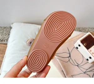 Detailed macro view showing the non-slip rubber sole of children's soft leather loafers