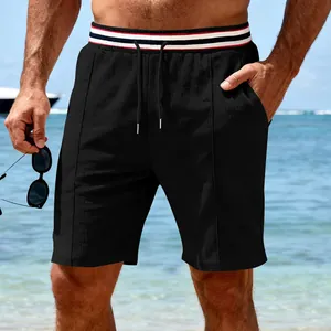 Men's black quick-dry breathable sports shorts with striped waistband beach view