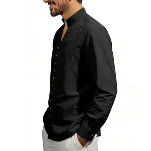 Side view detail of a black long-sleeved men's shirt with a stand collar and buttons.