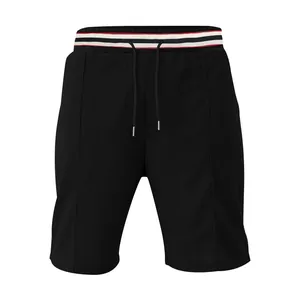 Professional front view of black quick-dry men's athletic shorts with striped elastic waistband