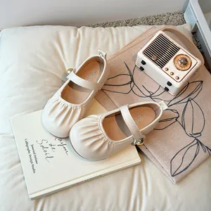Vintage cream leather Mary Jane flats for girls with pleated toe and gold buckle