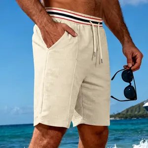 Detail view of men's quick-dry breathable cream shorts with stylish striped waistband