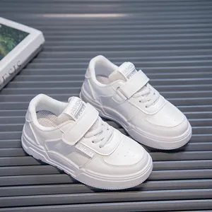 Classic white children's casual sneakers with soft soles and velcro straps for daily wear