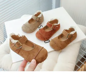 Vintage children's Mary Jane leather shoes with delicate lace trim and soft retro soles