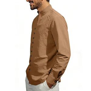 Detail view of a brown long-sleeved shirt with a stand-up collar and side buttons.