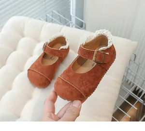 Vintage brown suede girls Mary Jane shoes featuring elegant white lace trim detail and soft soles